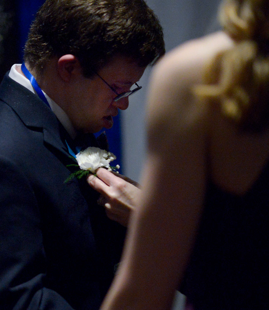 Christopher Mussatt receives a white boutonnière